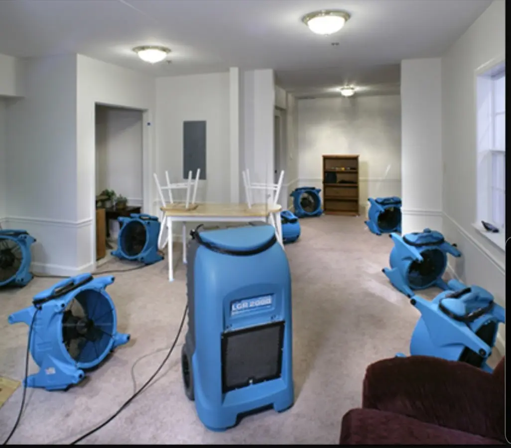 Air movers and dehumidifier setup for Water Damage Restoration in Watford City